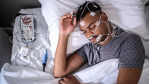Sleep study equipment setup showing polysomnography monitoring devices